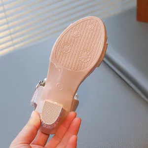 Close-up of the non-slip sole of pink girl's rhinestone princess sandals, size 27 marker