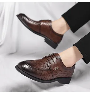 Close-up of vintage brown perforated men's leather shoes with textured finish.