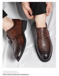 Close-up of men's brown hollow leather dress shoes with vintage hand-brushed texture