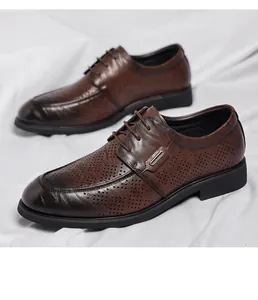 Detailed macro shot of brown vintage business leather shoes with hollow perforations.