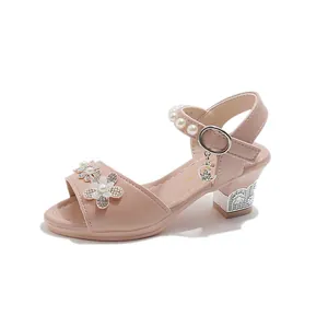 Detailed view of pink girls princess sandal with rhinestone flowers and pearls