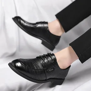 Classic men's black perforated formal leather shoes with a vintage hand-grabbed texture