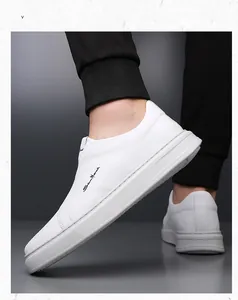 Side view detail of white men's leather slip-on shoes with soft sole and fine texture