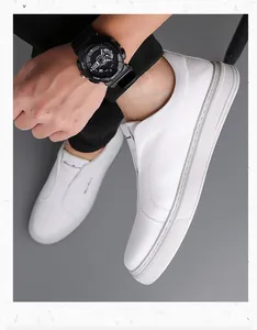 Close-up of white leather slip-on shoes with soft soles for breathable comfort and style