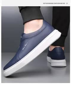 Detailed side view of navy blue men's leather slip-ons with thick white soft soles.
