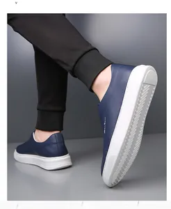 Detail of men's navy blue slip-on leather shoes with non-slip white herringbone sole