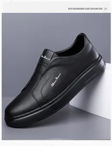 Detail view of men's black pebbled leather slip-on shoes featuring a comfortable soft sole