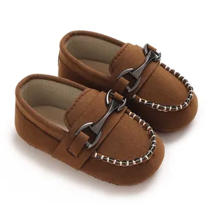 Classic brown baby walking shoes with matte finish and stylish metal buckle detail