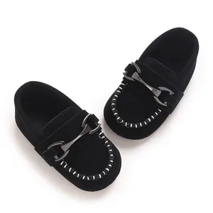 Black matte leather baby loafer shoes with metallic horsebit detail and contrast stitching