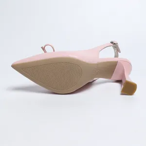 Detailed view of pink pointed toe slingback sandals featuring an elegant bow tie design