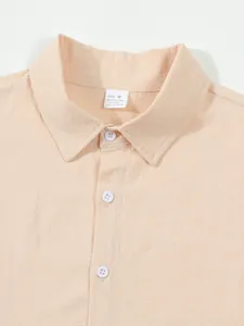 Detail of men's cotton linen shirt collar with size tag and button placket