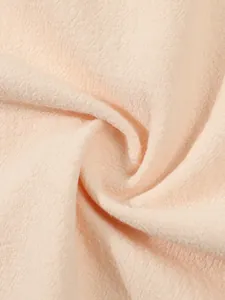 Macro detail of breathable peach cotton linen fabric texture for men's summer beach shirt