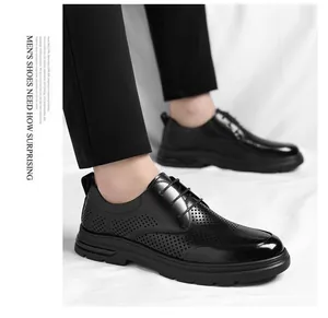 Close-up detail of black breathable hollow leather business dress shoes for men