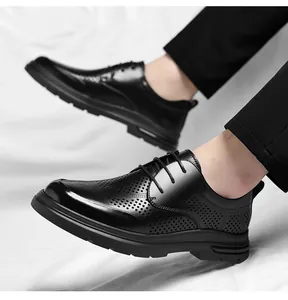 Close-up of men's breathable black perforated business shoes on feet