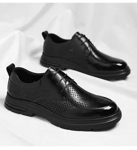 Detailed macro view of black business hollowed shoes with breathable perforated leather