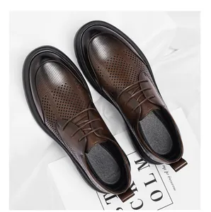 Close-up of men's brown leather business shoes with breathable hollow perforations.