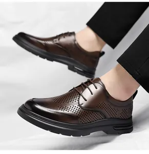 Close-up detail of brown perforated leather business shoes for men in stylish British design