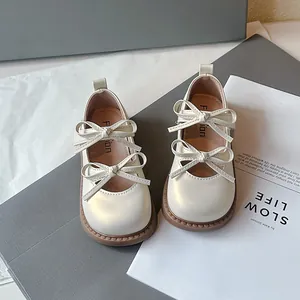 Elegantes zapatos de princesa marfil para niñas con lazos dobles y suelas blandas