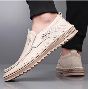 Detail of beige men's genuine leather slip-on loafers with durable rubber sole