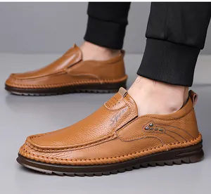 Detailed shot of brown genuine leather men's loafers with exquisite hand-stitched seams.