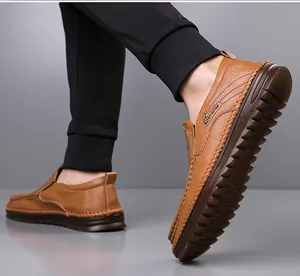 Detailed view of brown leather men's loafers featuring a durable non-slip rubber sole