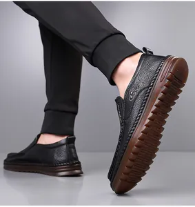 Close-up of men's black leather slip-on loafers with durable non-slip rubber sole