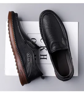 High-quality detail view of black genuine leather men's loafers showing pebbled texture