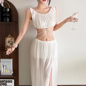 Detailed close-up of a white mesh two-piece outfit featuring multi-strand pearl body chains