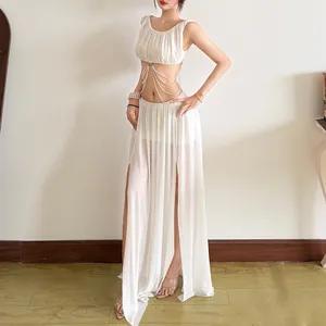 Detailed view of white mesh crop top and long skirt set with elegant pearl chain accents