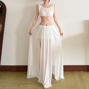 Detail of sexy white two-piece set with pearl chain crop top and sheer mesh maxi skirt.