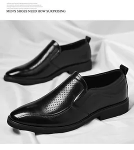 Nahaufnahme schwarzer perforierter Herren-Business-Schuhe auf elegantem weißem Stoff.