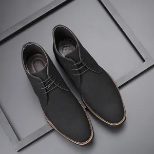 Detail view of premium matte black suede men's chukka boots with elegant lace-up design