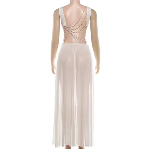 Back view of sexy white chain vest and sheer mesh maxi skirt set for women.