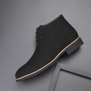 Detailed side view of men's matte black suede lace-up Martin boot with textured rubber sole
