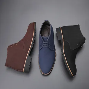 Professional flat lay of men's suede lace-up chukka boots in brown, blue, and black