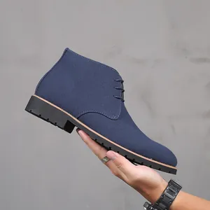 Detailed side view of blue suede men's chukka boots featuring a lace-up design and rubber sole