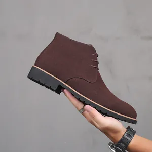Close-up of men's dark brown suede Martin boots featuring a sleek lace-up design