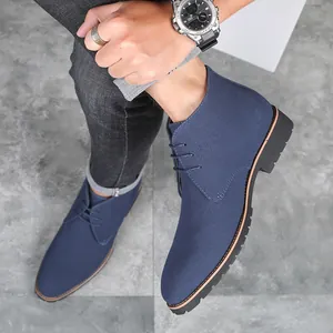 Detail view of stylish men's blue frosted suede casual boots with a classic lace-up design.