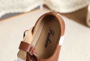 Close-up detail of the comfortable insole on these classic brown girls' shoes