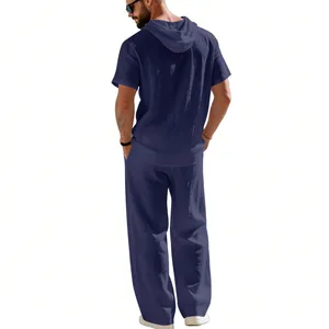 Back view of a navy blue men's linen short-sleeved hooded shirt and pants set.