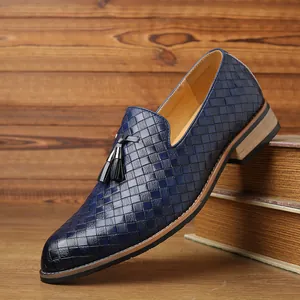 Close-up of blue woven leather texture on men's tassel loafers