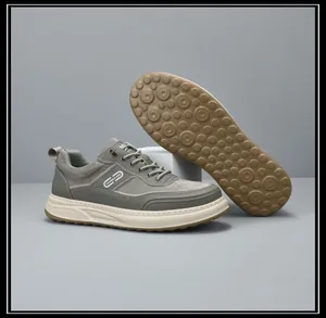 Grey men's casual sneakers with thick soles and non-slip patterned rubber outsole detail