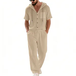 Detail view of men's loose linen hooded shirt and breathable beach pants set in beige