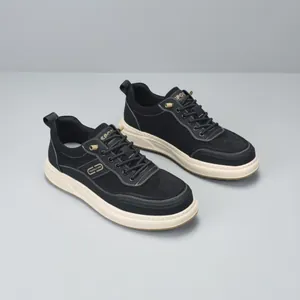 Stylish men's black sneakers with thick white soles and contrasting stitching