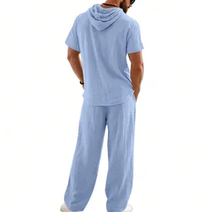 Back view of men's blue loose linen hooded shirt and breathable beach pants set
