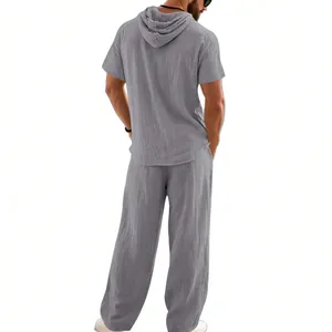 Back view of men's grey linen hooded shirt and loose pants set with textured fabric
