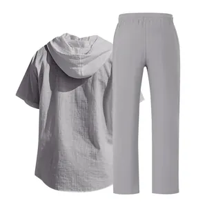 Back view of men's grey linen hooded short-sleeve shirt and matching beach trousers
