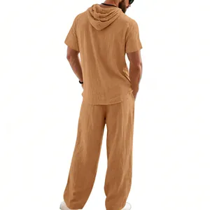 Back view of men's loose linen-blend summer beach set with short sleeve hoodie and trousers.
