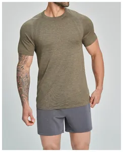 Close-up front view of men's seamless breathable olive green athletic T-shirt on model