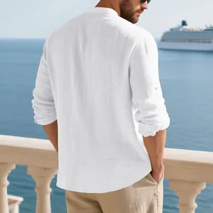 Back view of a men's white linen stand-collar shirt in a coastal vacation setting